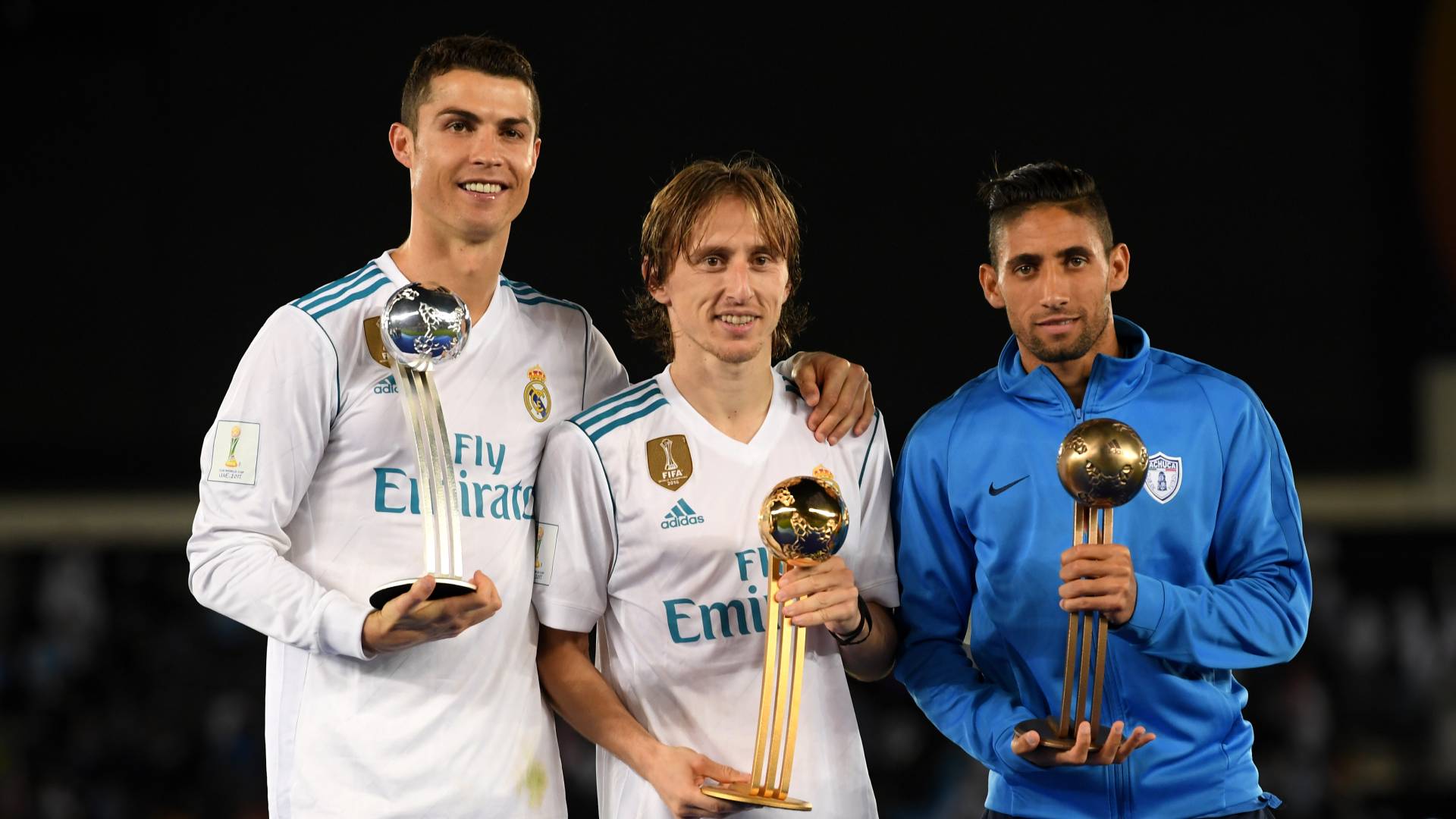 Cristiano Ronaldo of Real Madrid, Luka Modric of Real Madrid and Jonathan Urretaviscaya of CF Pachuca pose with there adidas Golden Ball trophys after the FIFA Club World Cup UAE 2017 Final