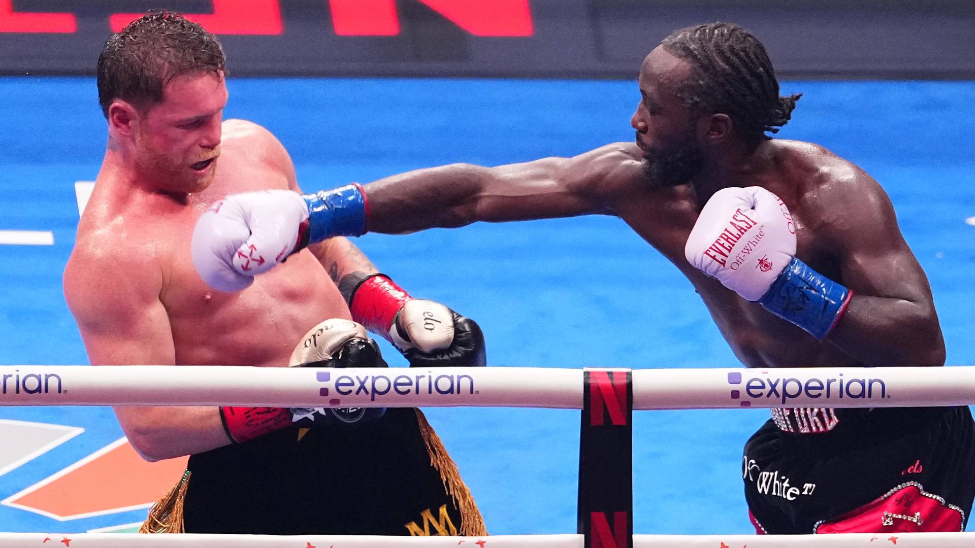 Canelo Alvarez exchanges punches with Terence Crawford in their undisputed super middleweight title fight