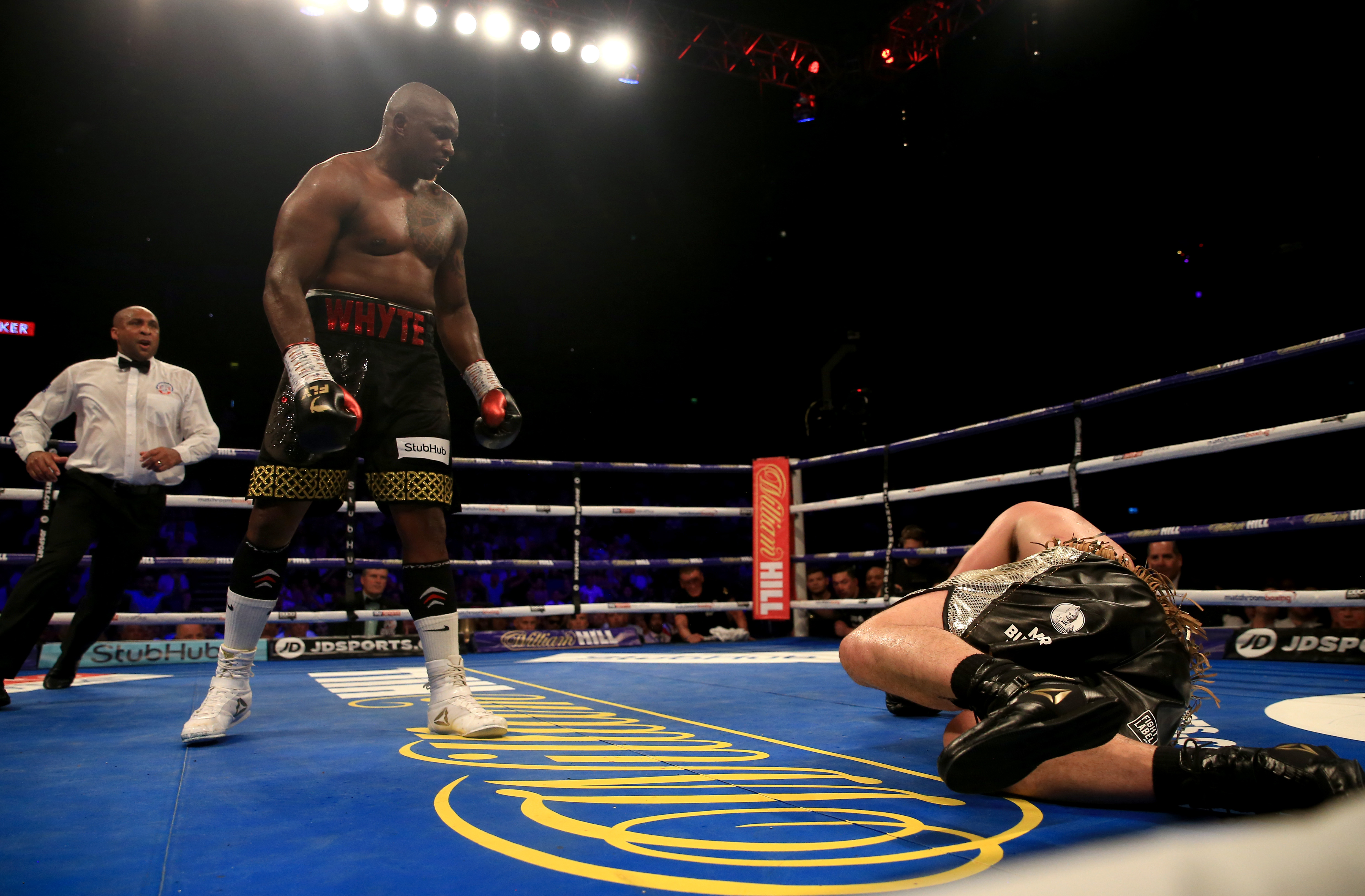 Dillian Whyte knocks down Joseph Parker during the Heavyweight fight
