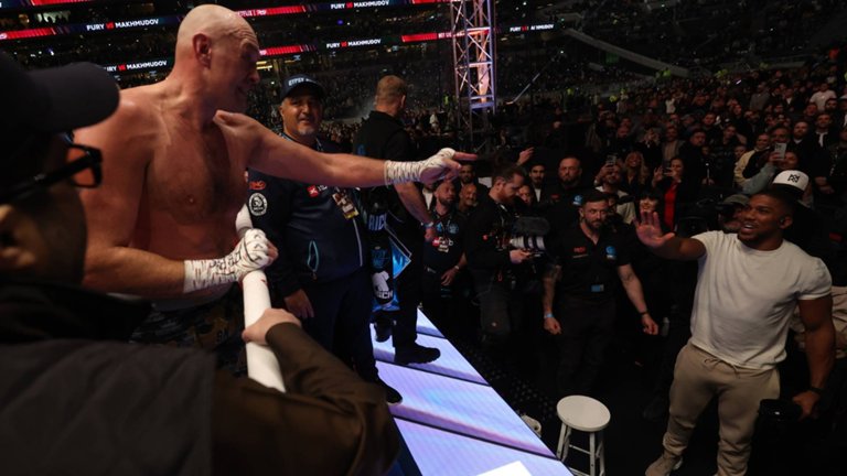 Fury and Joshua get up close and exchange words at Premier League stadium