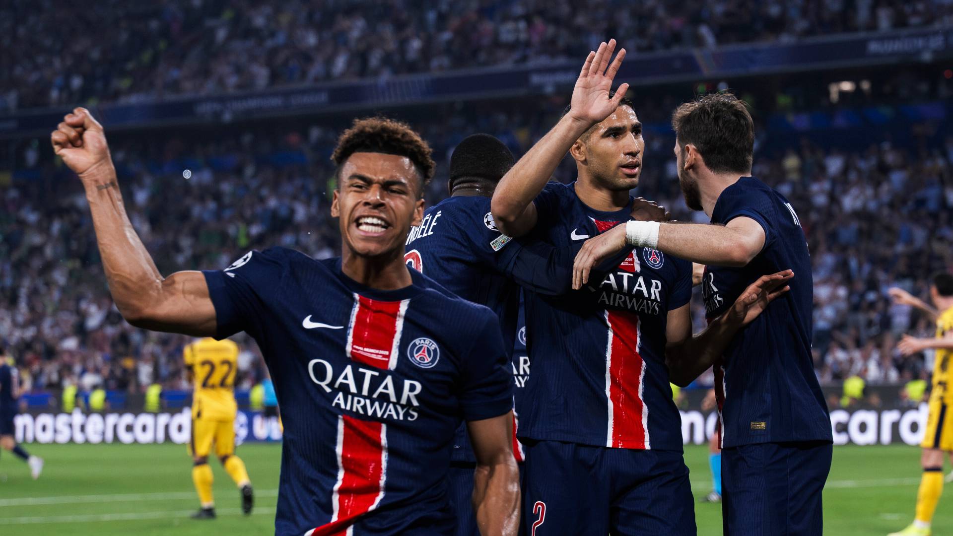 Achraf Hakimi (C) of Paris Saint-Germain FC celebrates with Desire Doue, Ousmane Dembele and Khvicha Kvaratskhelia