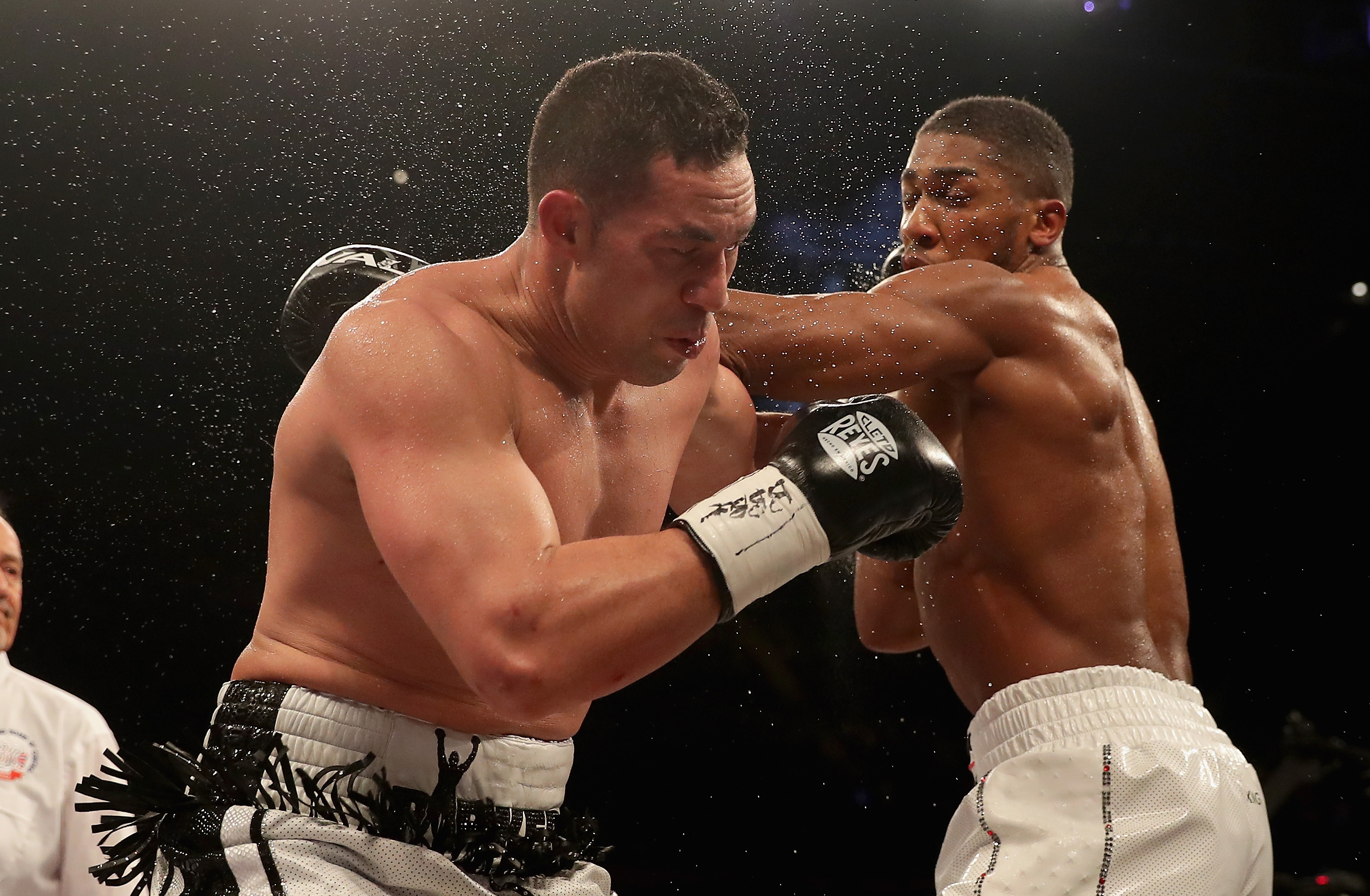 Anthony Joshua punches Joseph Parker during there WBA, IBF, WBO & IBO Heavyweight Championship title fight