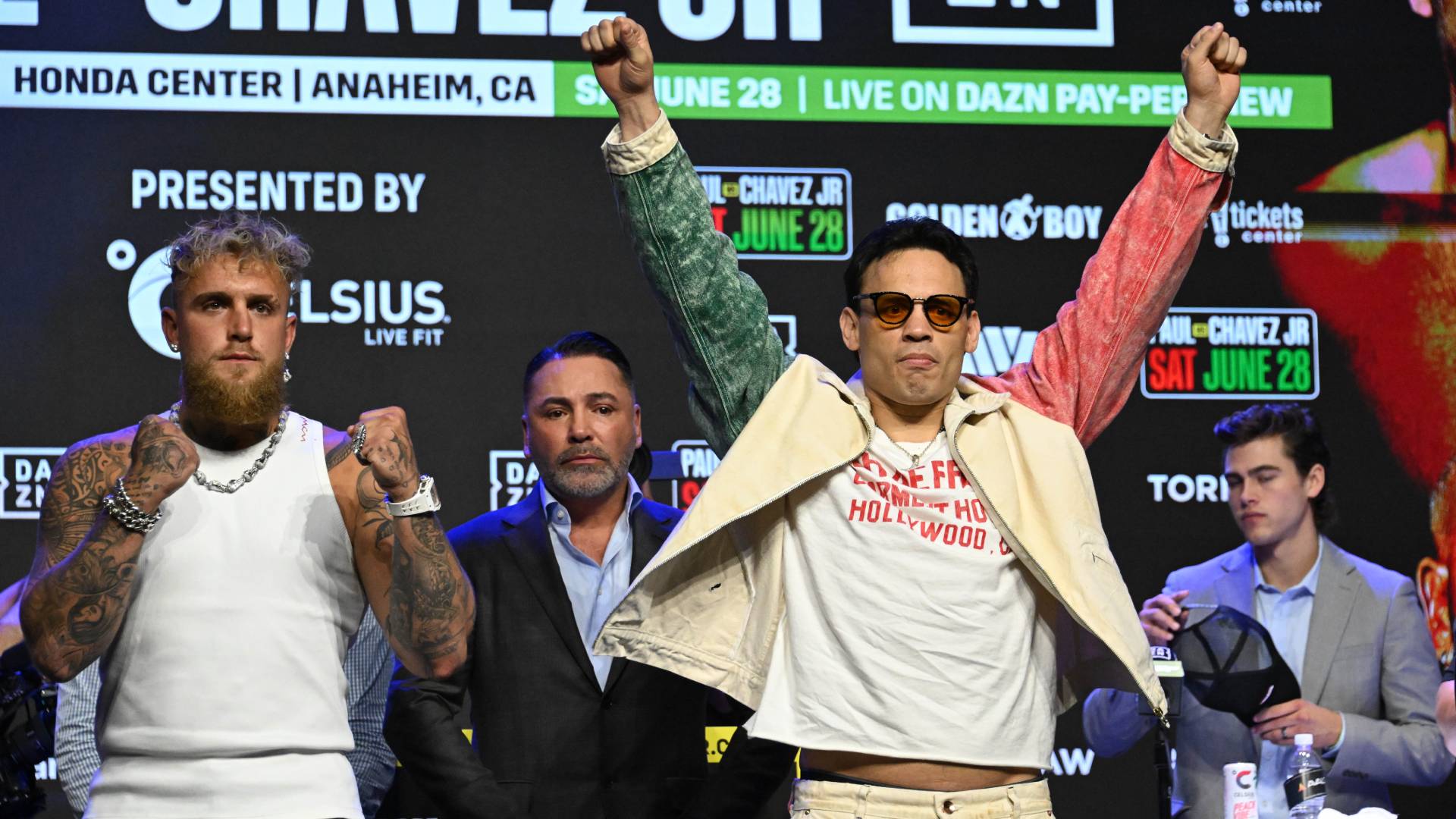 Jake Paul, left, gestures towards Julio Cesar Chavez Jr.,