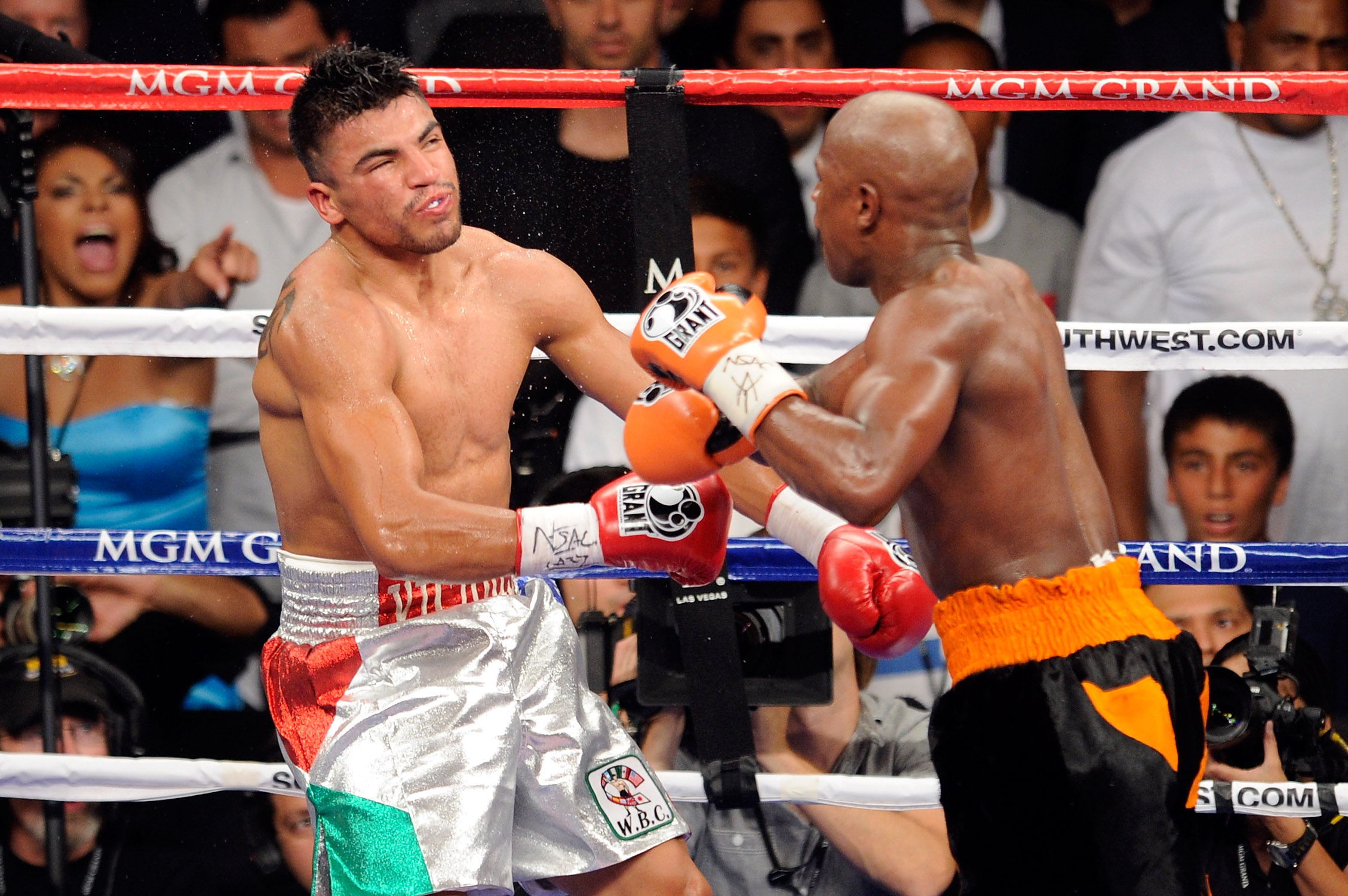 Floyd Mayweather Jr. knocks out Victor Ortiz in the fourth round during their WBC welterweight title fight