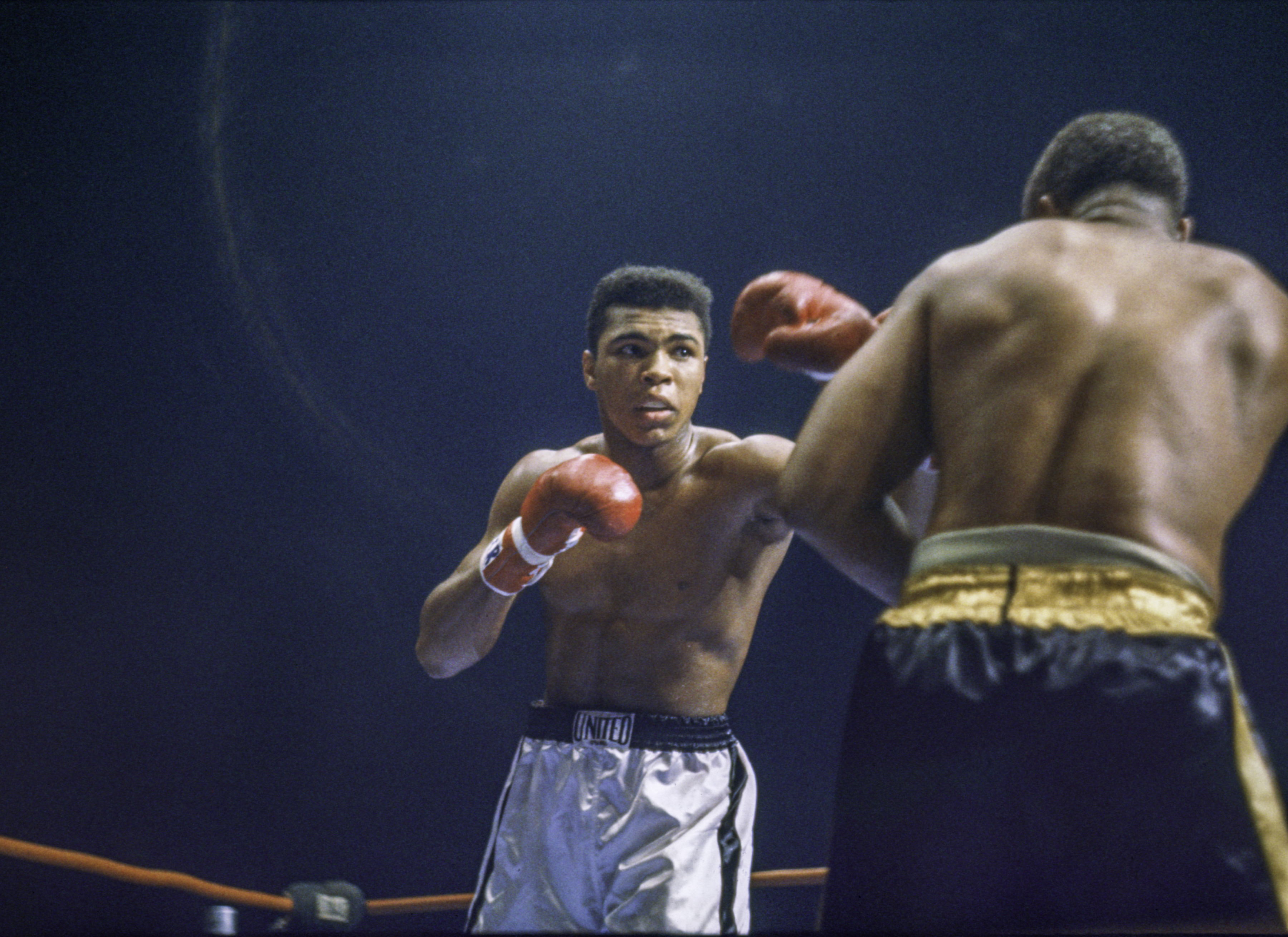 Cassius Clay (L) and Archie Moore during the fight at the Sports Arena on November 15, 1962