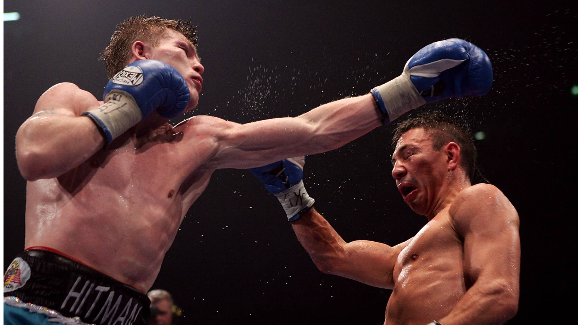 Ricky Hatton (L) fights Kostya Tszyu during the IBF light welterweight title fight at the MEN Arena on June 4, 2005 in Manchester