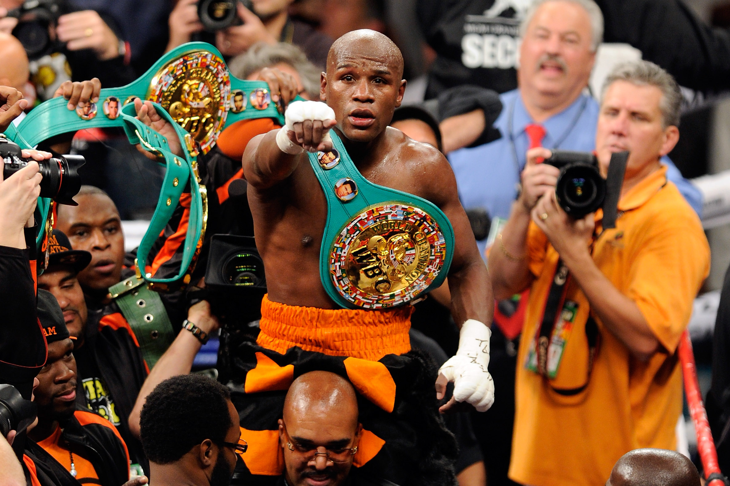 Floyd Mayweather Jr. celebrates after defeating Victor Ortiz by fourth round knockout