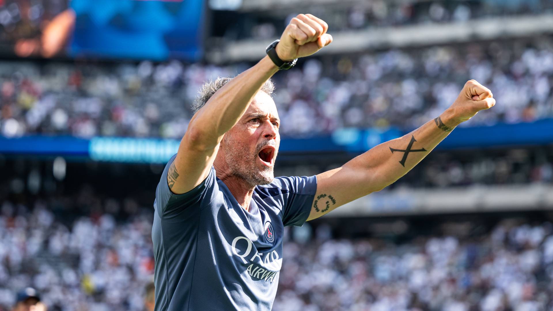 Head coach Luis Enrique of PSG celebrates victory