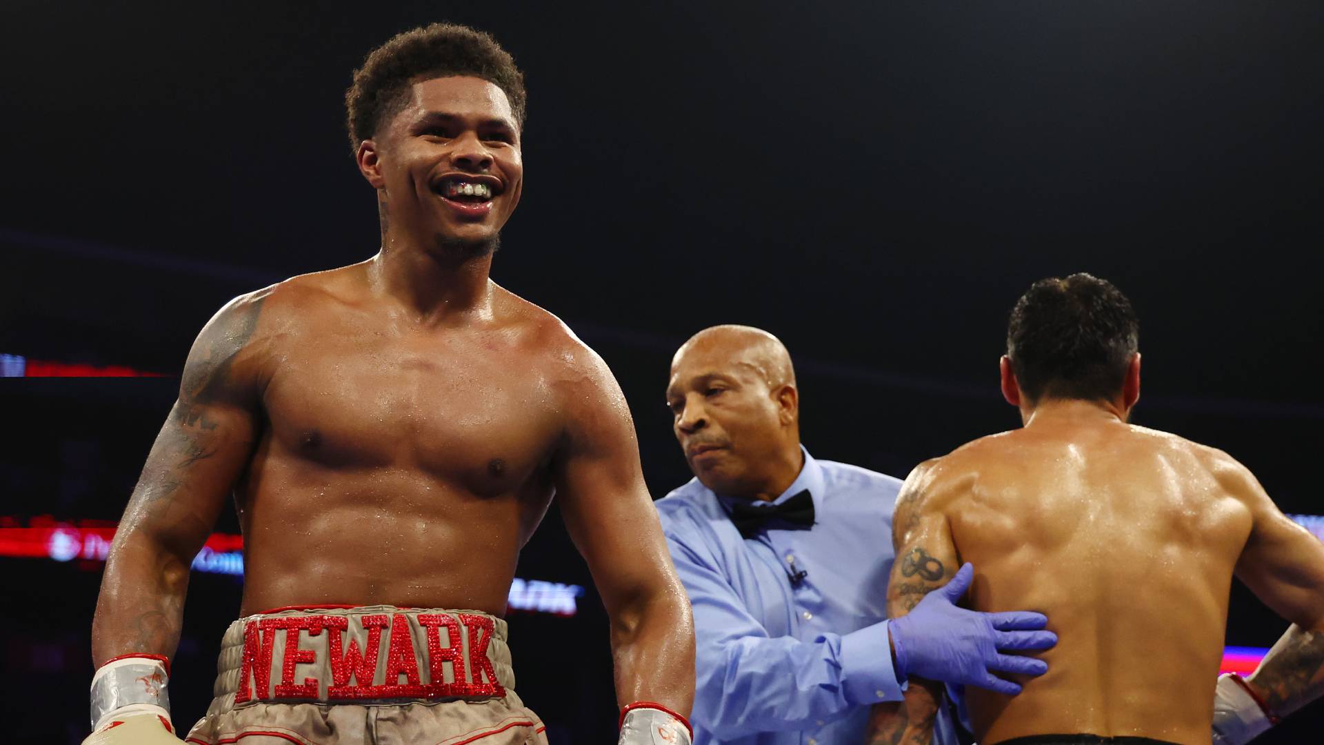 Shakur Stevenson (gold gloves) reacts against Artem Harutyunyan of Germany