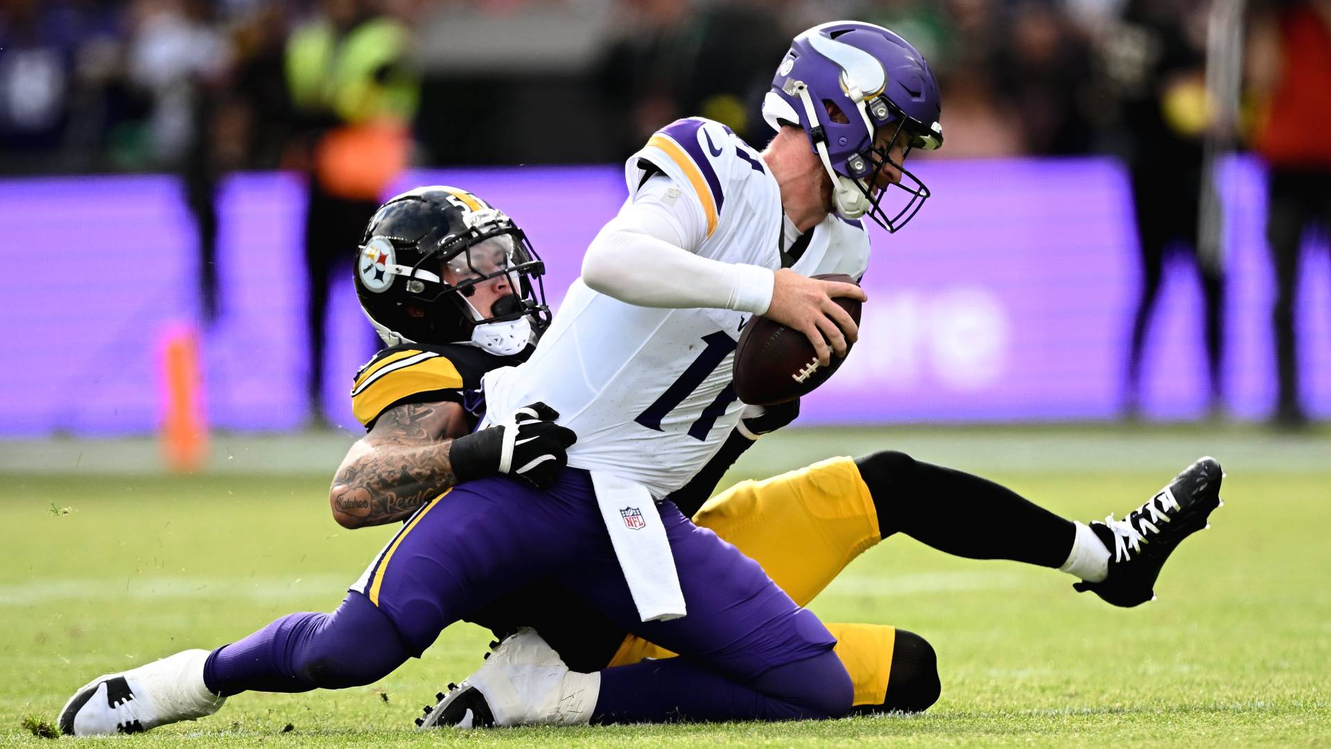 Quarterback Carson Wentz #11 of Minnesota Vikings is tackled by Linebacker Nick Herbig #51 of Pittsburgh Steelers