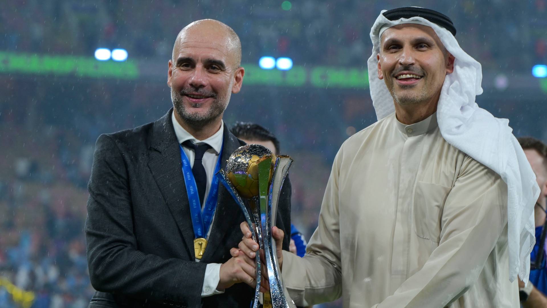 Manchester City Pep Guardiola Manager and chairman Khaldoon Al Mubarak pose with the FIFA Club World Cup Trophy after the FIFA Club World Cup Final