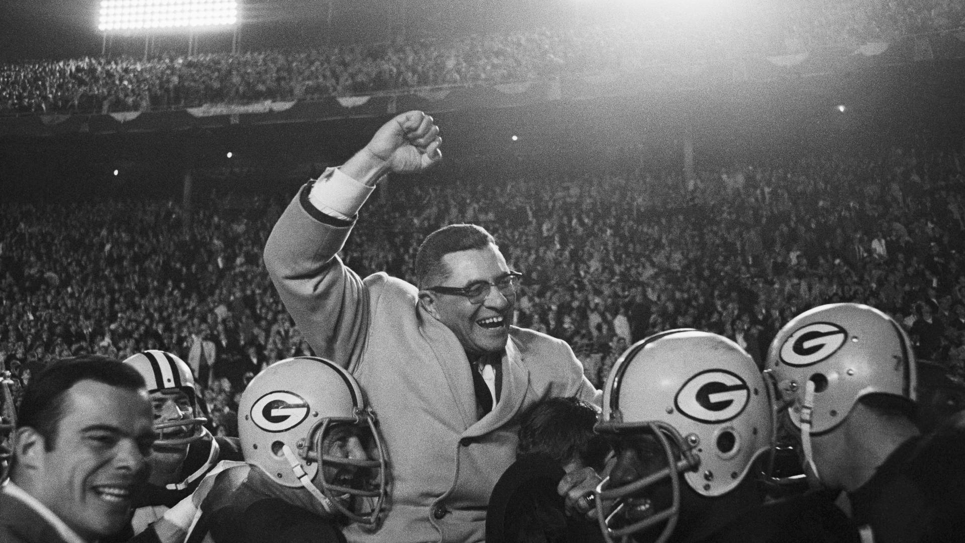 Vince Lombardi being carried by Green Bay Packers