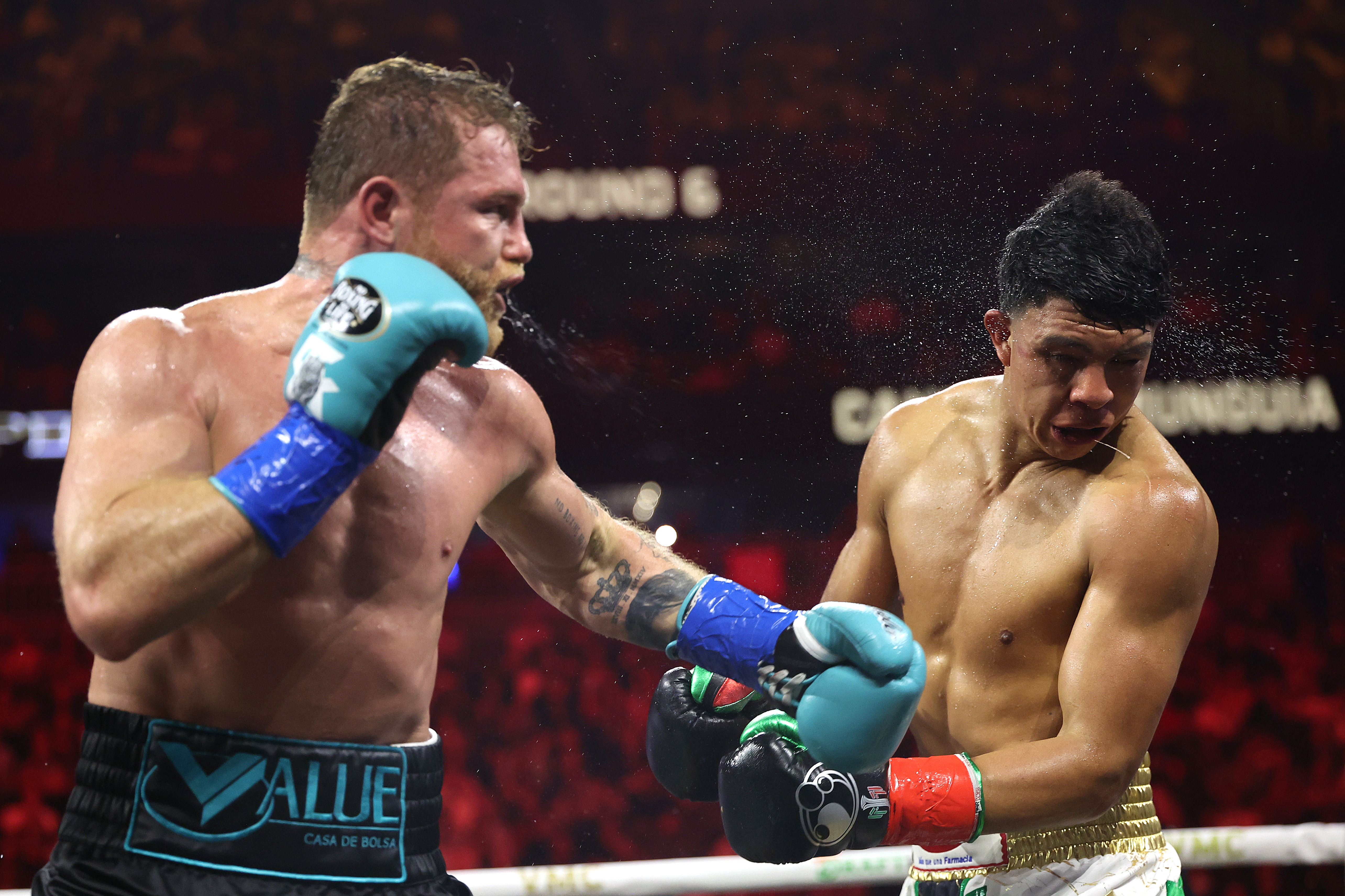 Canelo Alvarez lands a left against Jaime Munguia in their super middleweight championship title fight