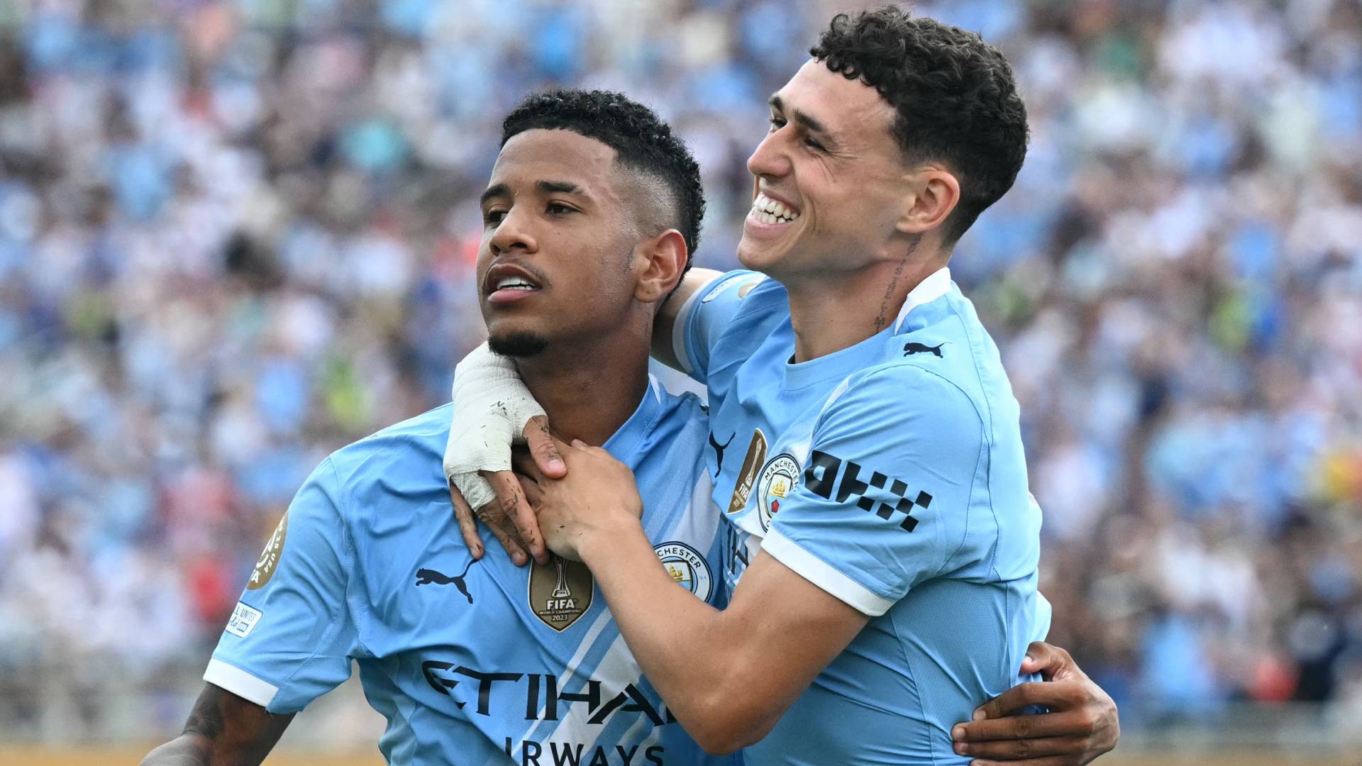 Manchester City's Phil Foden celebrates with Savinho