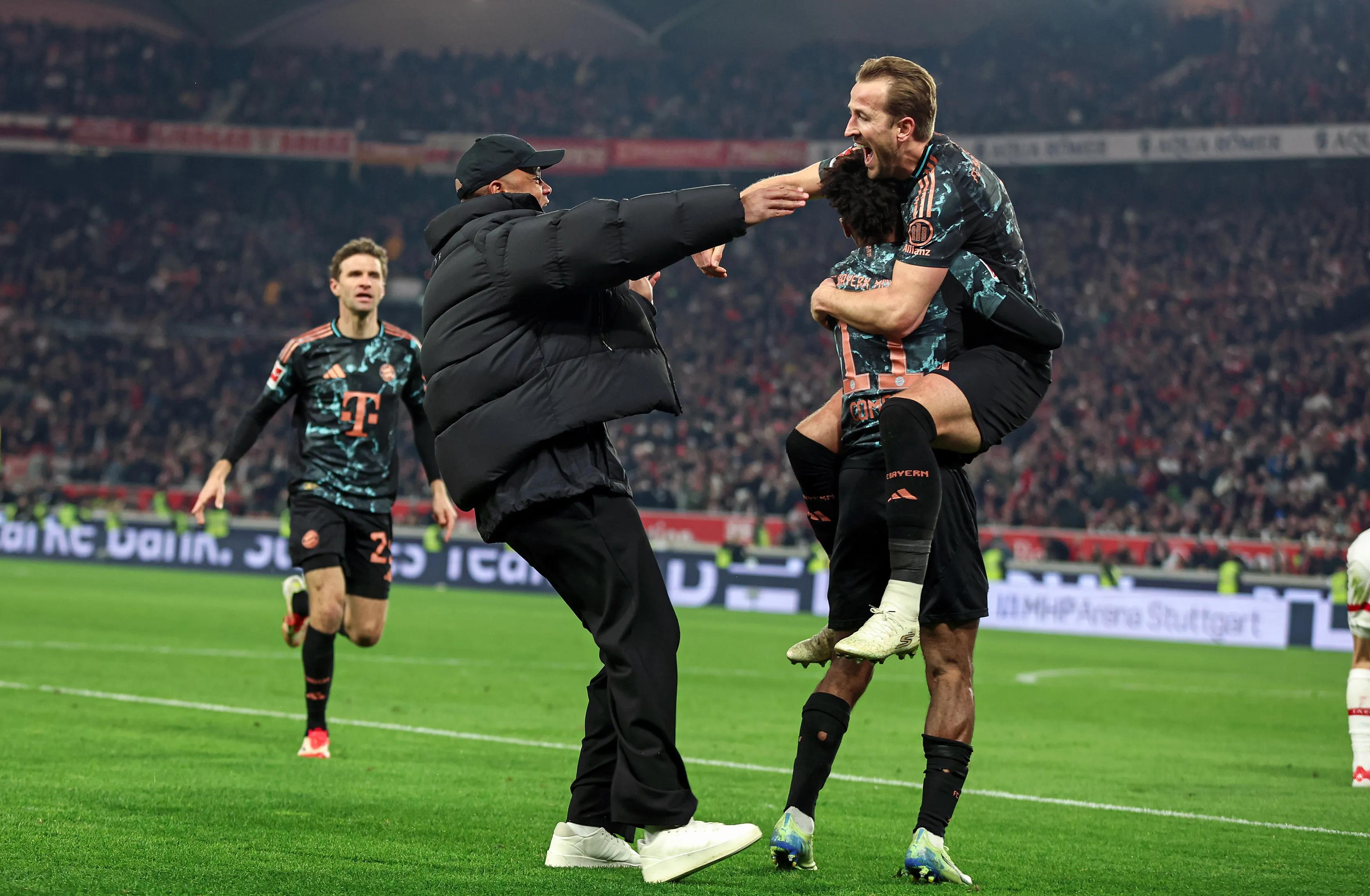 transform-c286fe2c-9b5a-45cc-ac9c-3c17af93c567-Vincent-Kompany-running-on-the-pitch-and-celebrating-with-Harry-Kane-after-a-Bayern-goal