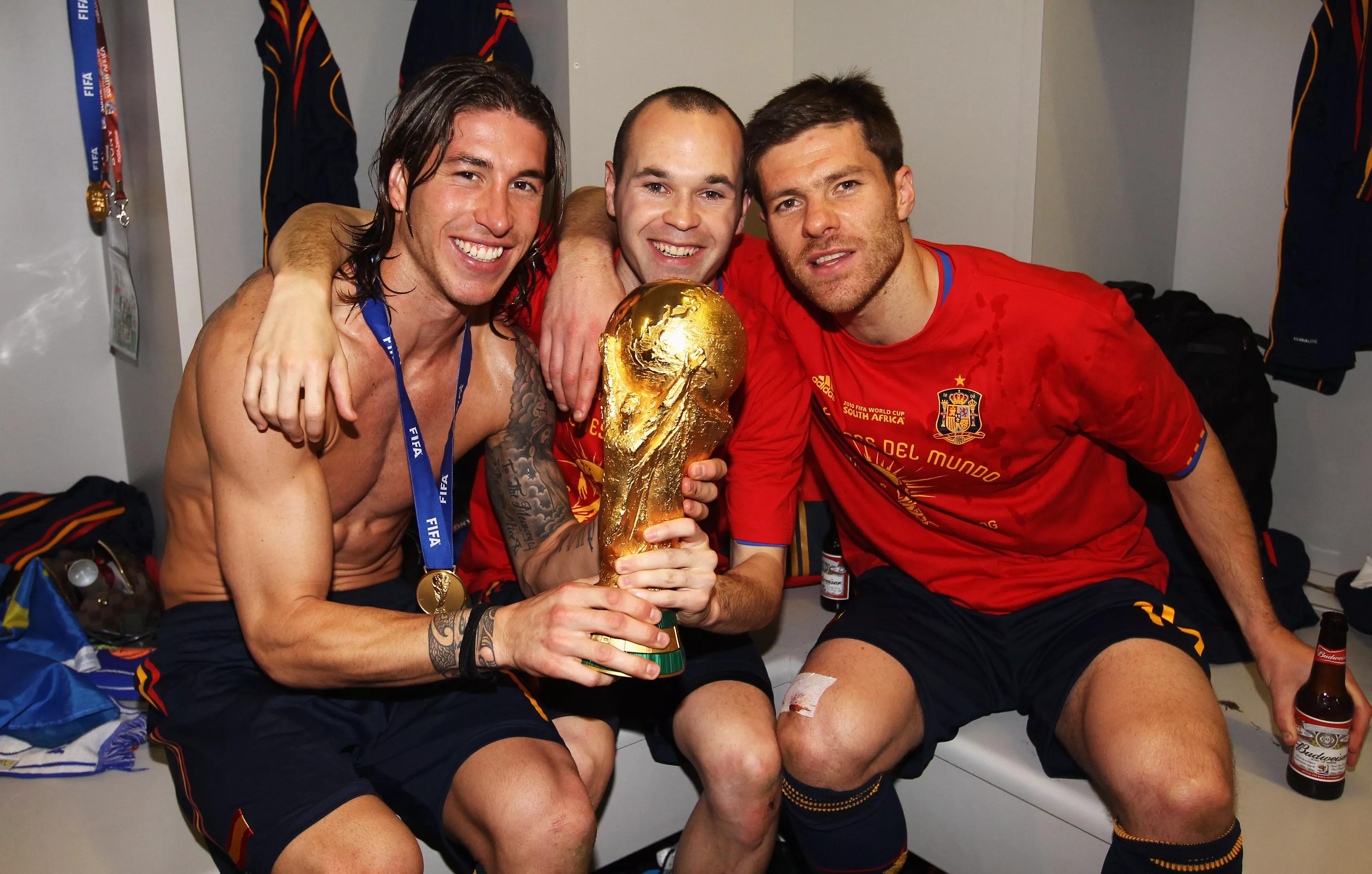 transform-f13e266c-f65c-4c0d-8118-42c6c6470a0e-Sergio-Ramos-Andres-Iniesta-and-Xabi-Alonso-celebrate-with-the-trophy-after-Spain-won-South-Africa-2010