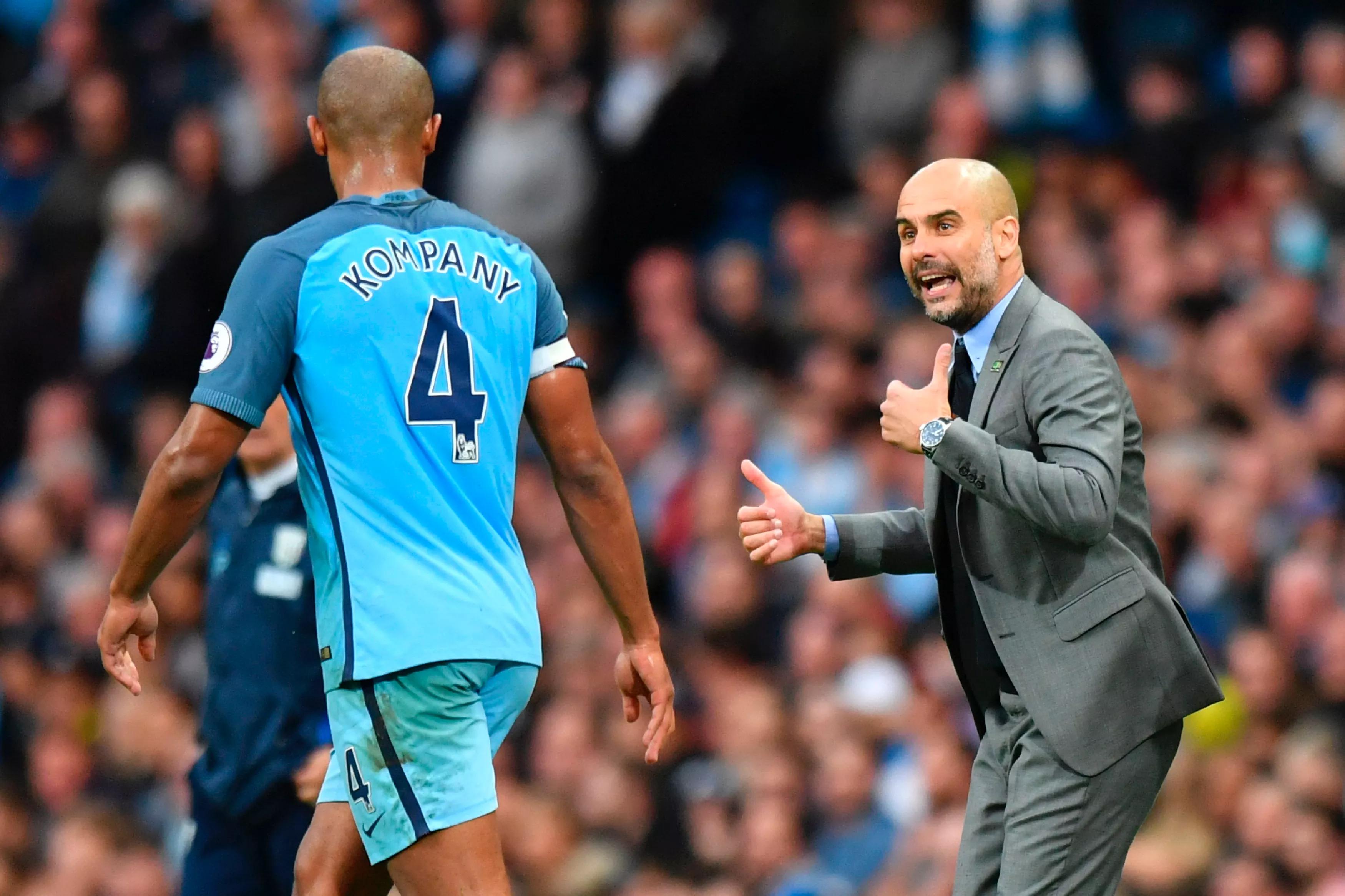 transform-ff2bc5a8-ba78-47e2-adb3-e65a1888c792-Manchester-City-s-Spanish-manager-Pep-Guardiola-R-gives-instructions-to-Manchester-City-s-Belgian-defender-Vincent-Kompany-L-during-the-English-Premier-L