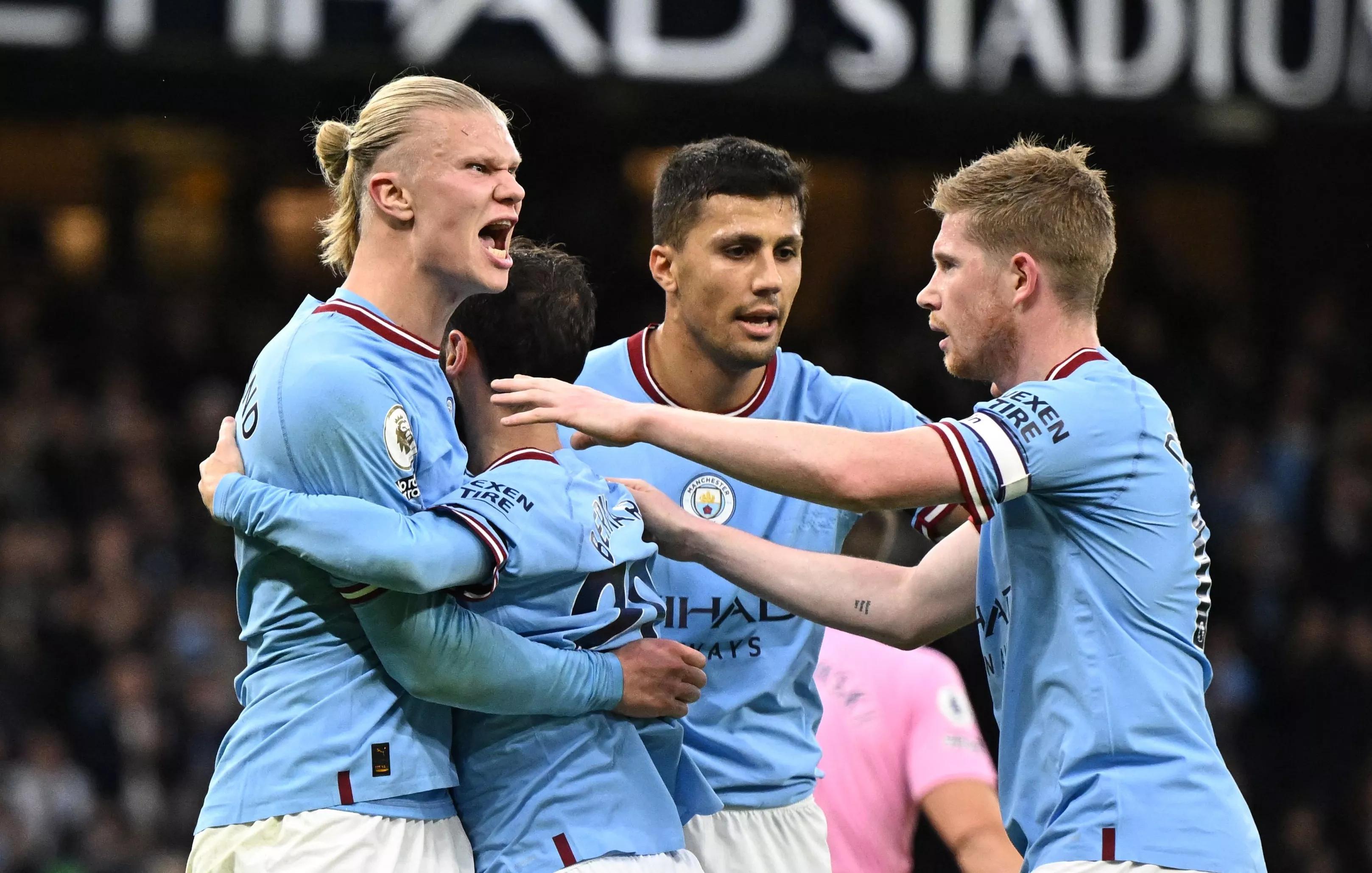 transform-2a80ac1e-01e5-4cae-9685-044940c7070e-Manchester-City-s-Norwegian-striker-Erling-Haaland-L-celebrates-with-teammates-after-scoring-the-opening-goal-of-the-English-Premier-League-football-matc