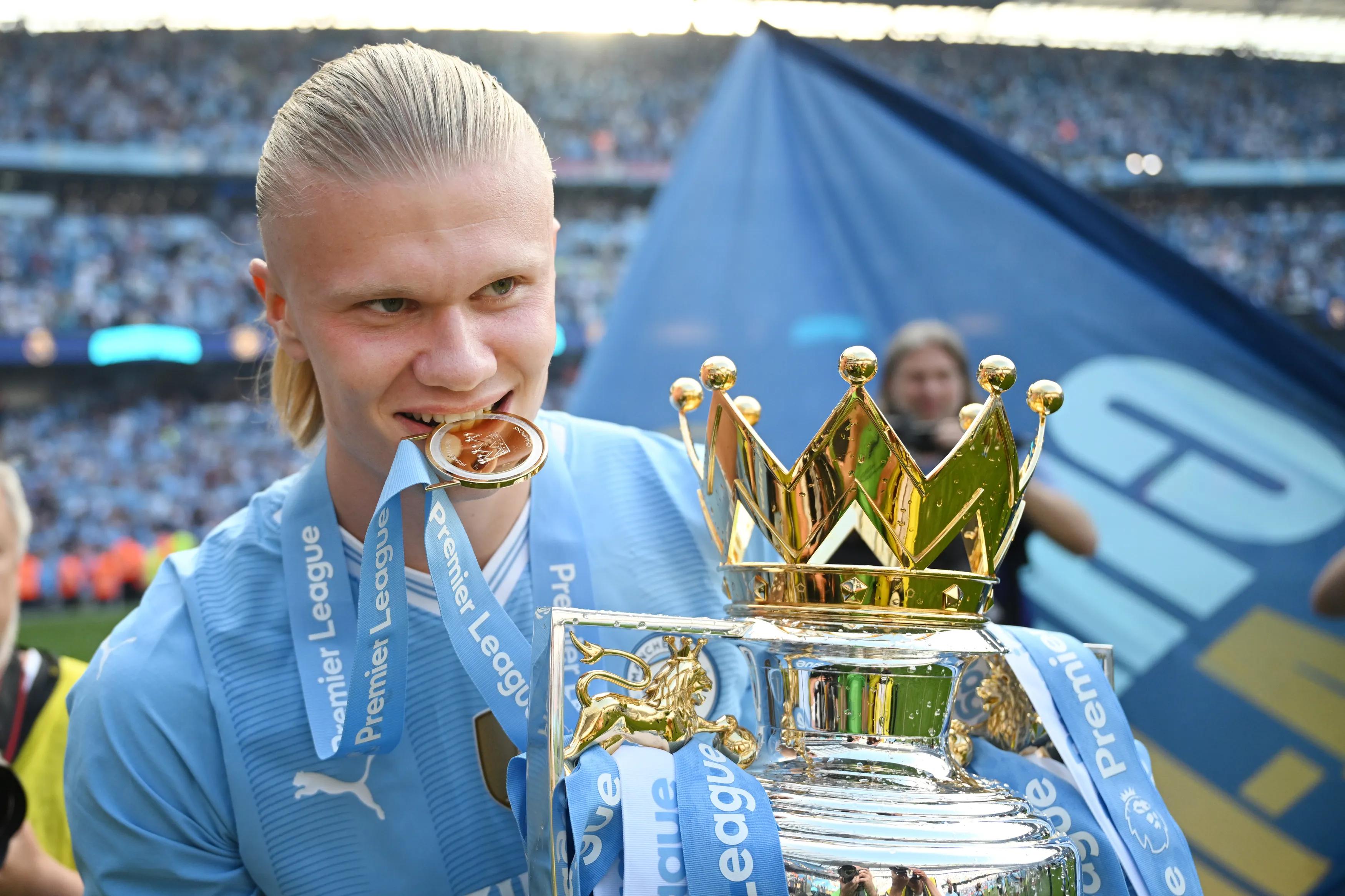 transform-118cf5ee-bd04-4a6e-ba54-a28919c29857-MANCHESTER-ENGLAND-MAY-19-Erling-Haaland-of-Manchester-City-poses-with-the-Premier-League-trophy-after-the-Premier-League-match-between-Manchester-City-a