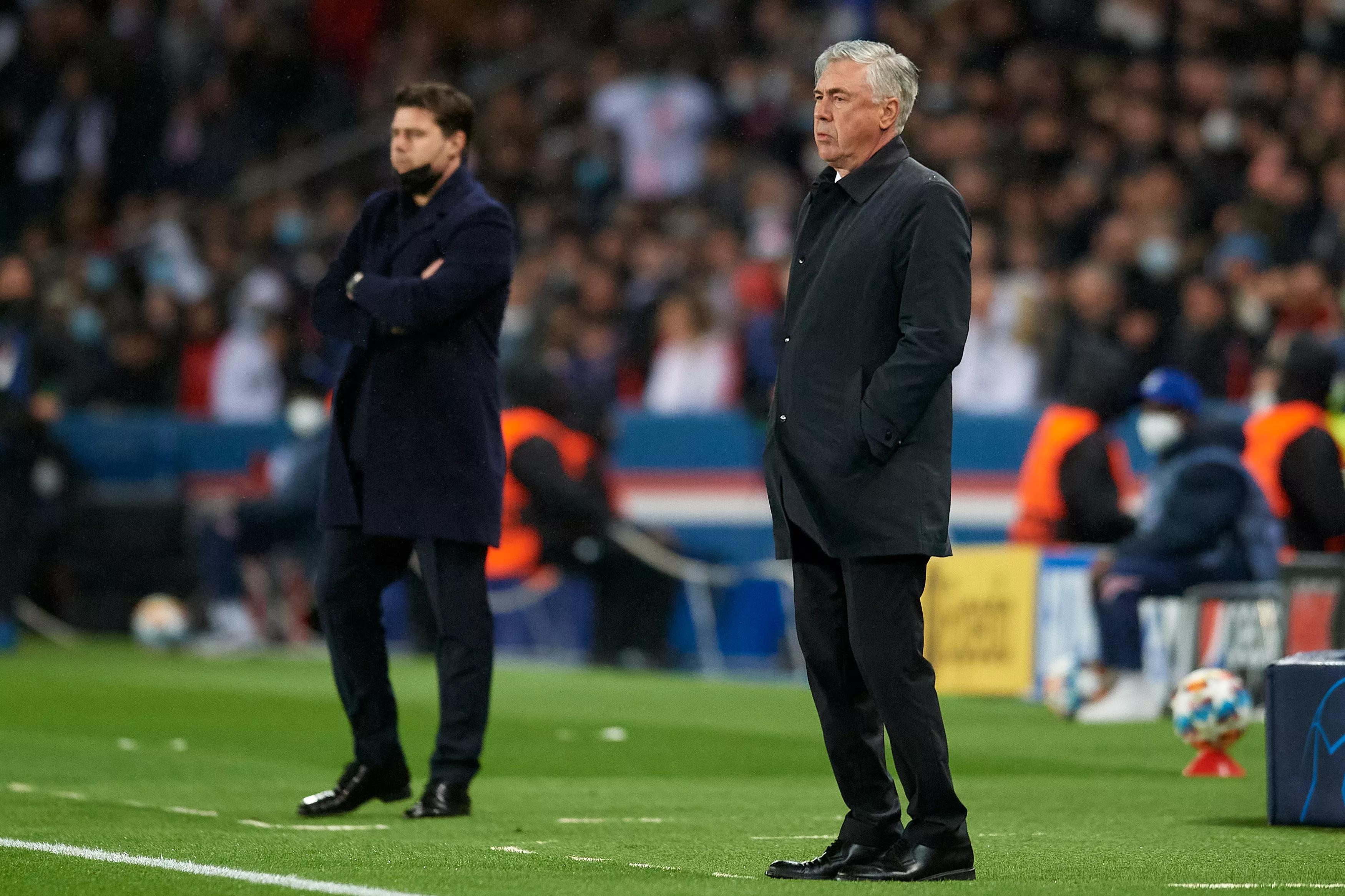 transform-b3c5fca1-790e-4d60-ad0d-66fd37337e4a-Carlo-Ancelotti-of-Real-Madrid-and-Mauricio-Pochettino-head-coach-of-PSG-during-the-UEFA-Champions-League-Round-Of-Sixteen-Leg-One-match-between-Paris-Sa
