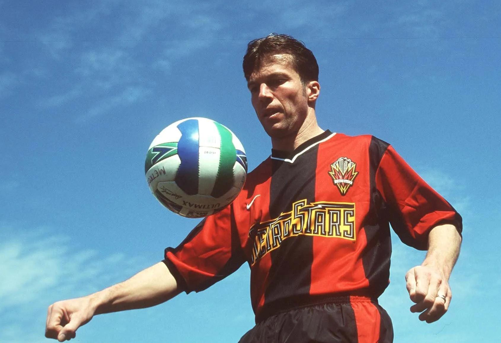 transform-bdb63c29-d4c8-47bc-8aac-d3fbf217add8-Lothar-Matthaus-playing-with-a-football-in-the-jersey-of-New-York-Metro-Stars