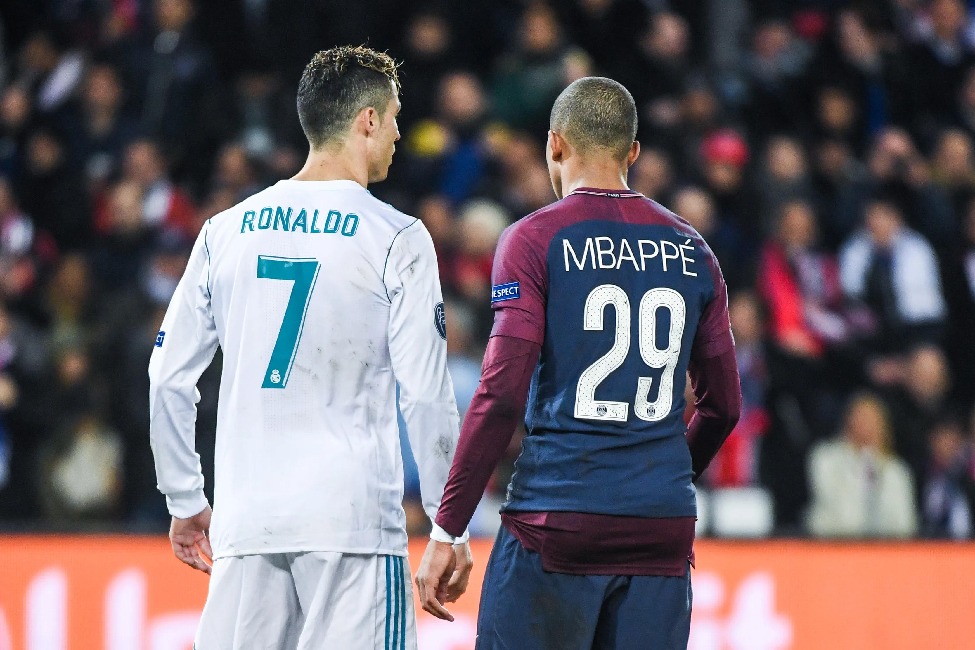 transform-3e8c30c3-e9a7-44e8-bd6e-7e5a9a2969b2-Cristiano-Ronaldo-of-Real-Madrid-and-Kylian-Mbappe-of-PSG-during-the-UEFA-Champions-League-Round-of-16-Second-Leg-match-between-Paris-Saint-Germain-and-R