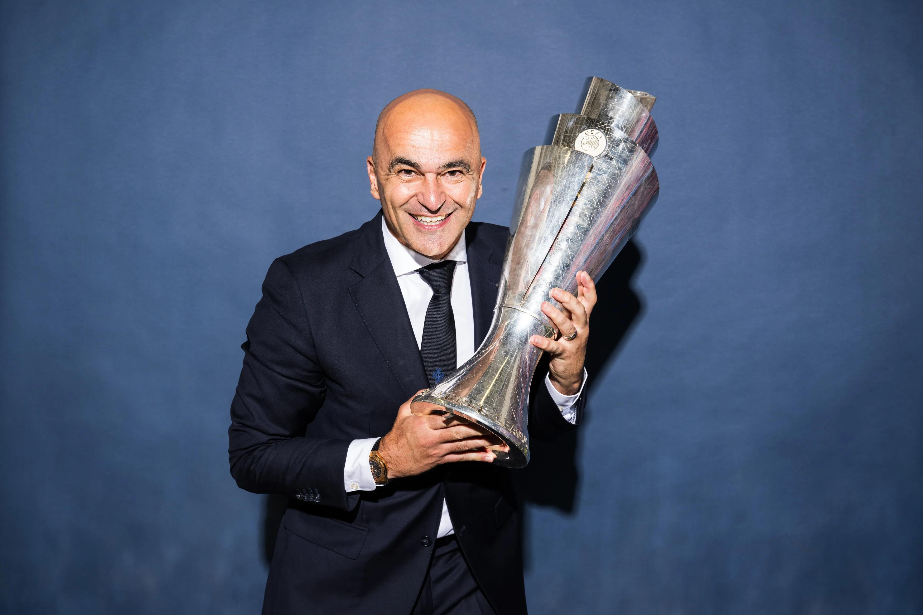 transform-4a36c75d-03c9-4433-be4c-9005beeff4af--Roberto-Martinez-Manager-of-Portugal-poses-for-a-photo-with-the-UEFA-Nations-League-trophy-during-the-official-UEFA-Nations-League-2025-Winners-shoot-af